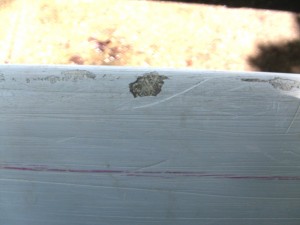 Exposed fiberglass and gelcoat scrapes